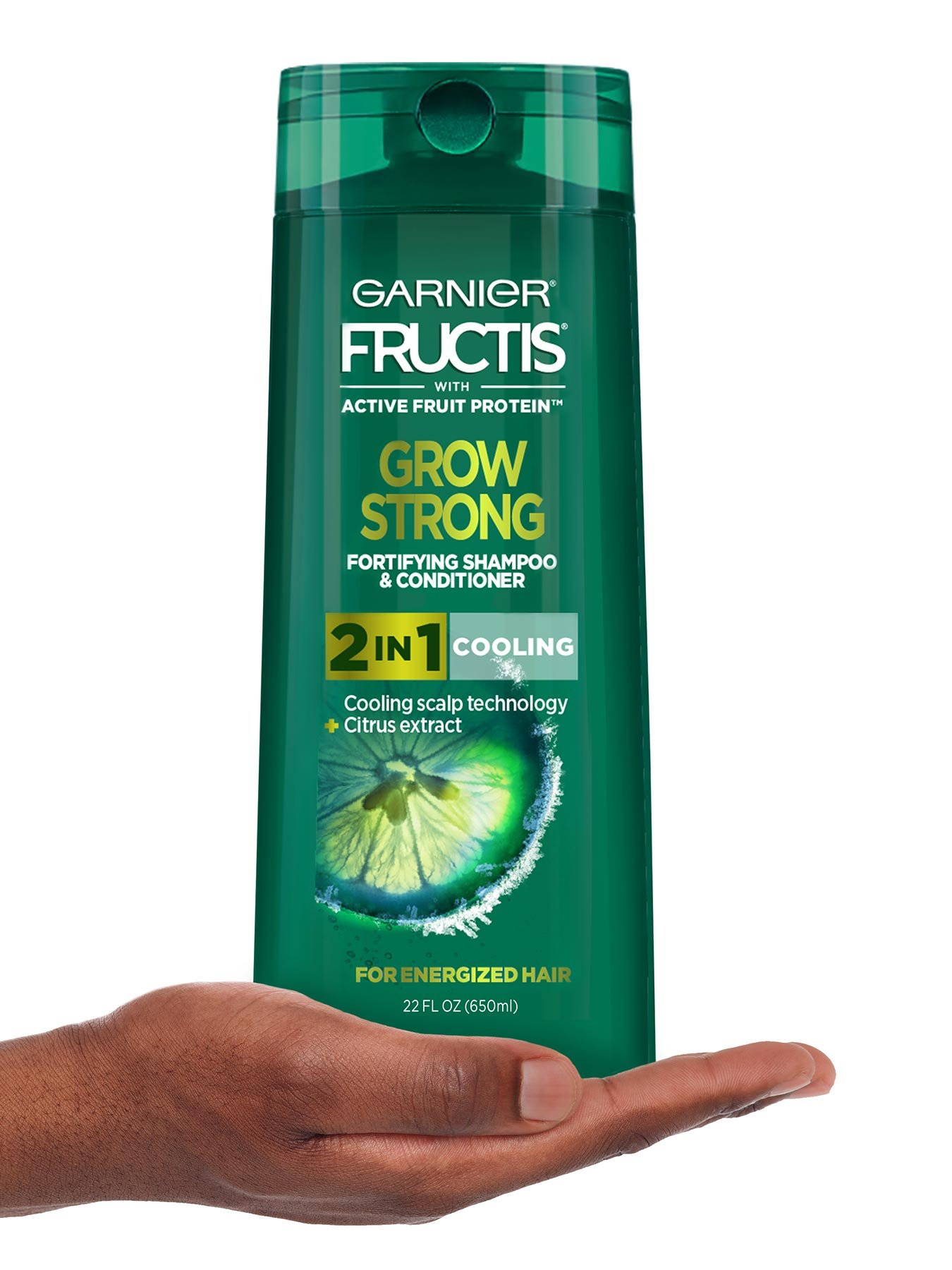 Hand holding Cooling 2-In-1 Shampoo and Conditioner for Men.